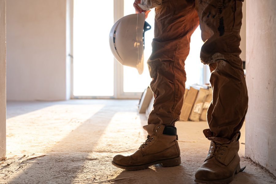 man-builder-with-helmet-his-hands-copy-space